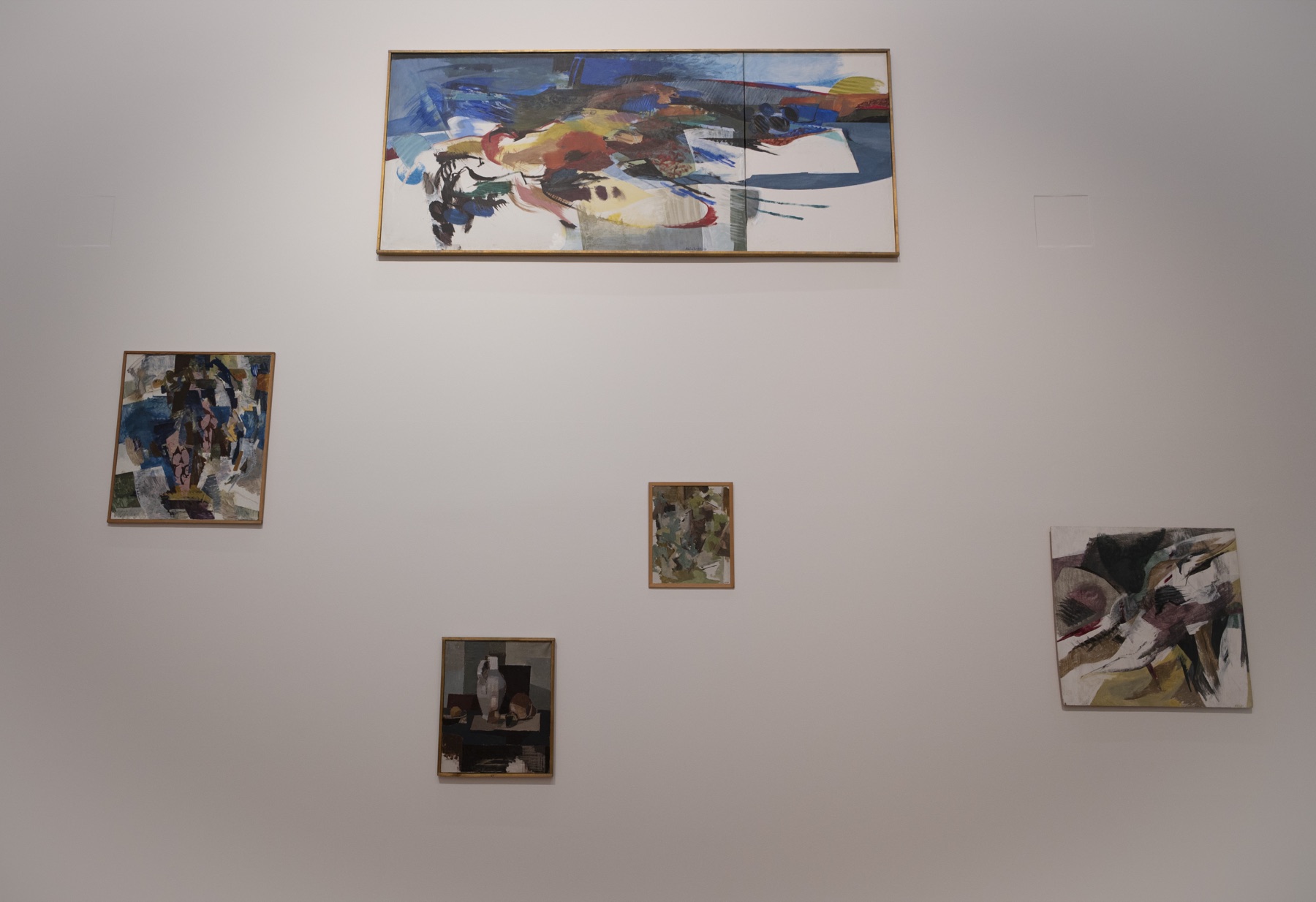 Installation view of Kajsa Zetterquist’s paintings arranged across a gallery wall